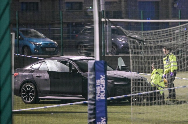 Alamy Live News. 3A0X2Y2 Shap Road, Kendal, Cumbria 4th March 2025: Cumbrai Police investigate after a car crashed through a fence at Kendal Rugby Union Football Club, down to a pitch from the car park, hitting children playing football below. One child has died from their injuries. Cumbria Police statement: Police were contacted at 4:58pm today (5 March) with a report of a collision involving a car and two children on a pitch at Kendal Rugby Union Football Club on Shap Road. Police can confirm that one of the children involved has sadly died. The second child involved in this collision is being treated by paramedics. This is an Alamy Live News image and may not be part of your current Alamy deal . If you are unsure, please contact our sales team to check.