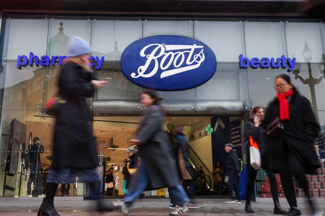 Pedestrians pass a Boots store in London, UK, on Wednesday, Dec. 13, 2023. The owner of Boots, Walgreens Boots Alliance Inc., is reviving discussions on a potential exit from the UK pharmacy chain, nearly 18 months after a sale process was scrapped, people with knowledge of the matter said.??Photographer: Hollie Adams/Bloomberg via Getty Images