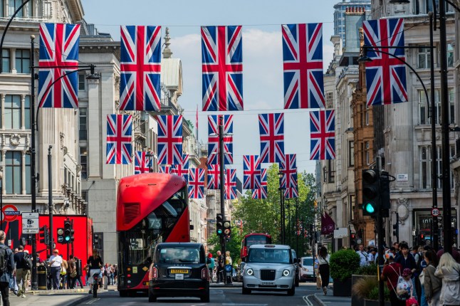 Mandatory Credit: Photo by Guy Bell/Shutterstock (15274277b) Union Jacks are out, which is good timing for the upcoming VE Day celebrations - The street is busy in the warm weather of the mini-heatwave as Post Marathon runners mingle with normal shoppers in Oxford street, London. Post Marathon shoppers Oxford street, London., UK - 28 Apr 2025