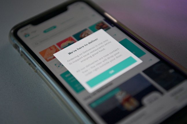 A photograph arranged as an illustration in Brenchley, south-east England on August 18, 2020 shows the food delivery Deliveroo app on a smart phone. (Photo by BEN STANSALL / AFP) (Photo by BEN STANSALL/AFP via Getty Images)